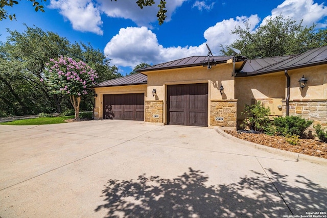 view of side of property featuring a garage