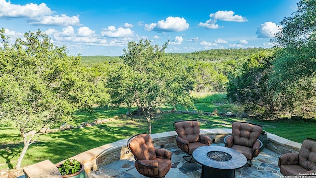 view of patio with an outdoor fire pit