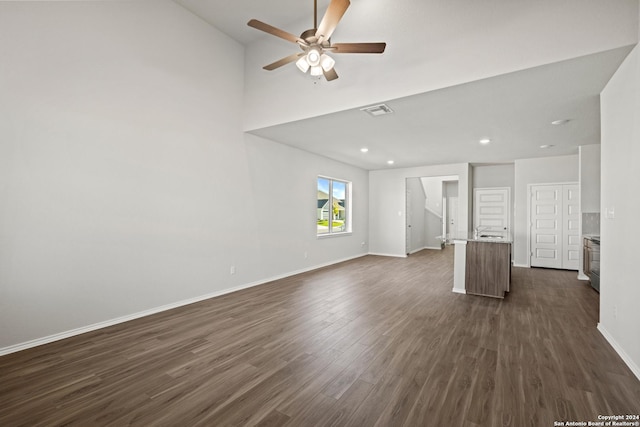 unfurnished living room featuring dark wood finished floors, recessed lighting, visible vents, ceiling fan, and baseboards