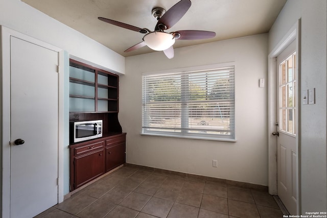 kitchen featuring tile patterned flooring, a wealth of natural light, and ceiling fan