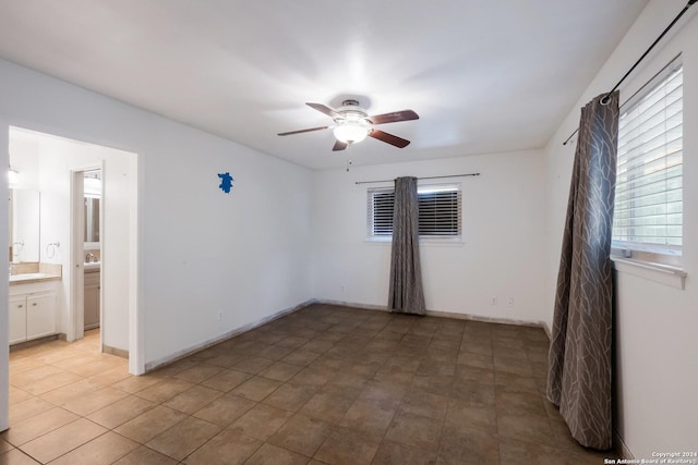 spare room with ceiling fan