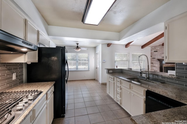 kitchen featuring black appliances, ceiling fan, white cabinetry, and sink