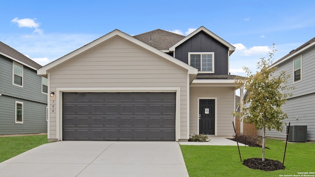 view of front of property with a front lawn and central AC