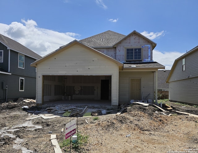 view of front of property with a garage