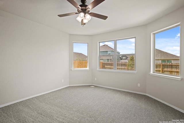 unfurnished room featuring carpet floors and ceiling fan