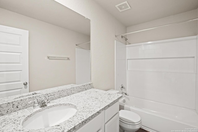 full bathroom featuring toilet, vanity, and shower / bathtub combination