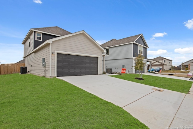 front of property with a front lawn and central air condition unit