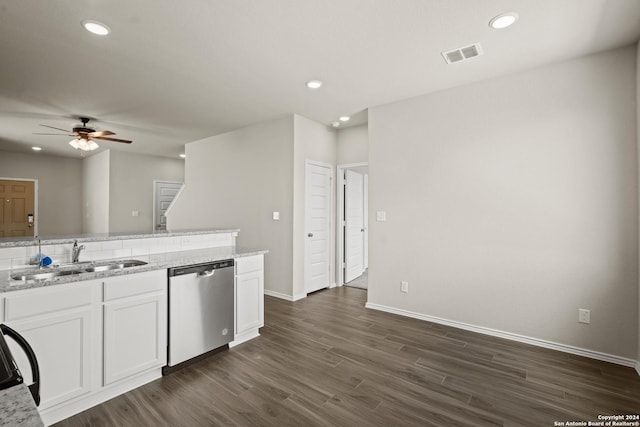 kitchen with light stone counters, sink, white cabinetry, and dishwasher