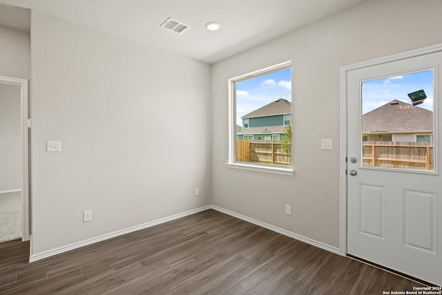 doorway to outside with dark hardwood / wood-style floors