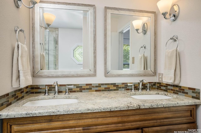 bathroom featuring vanity and backsplash