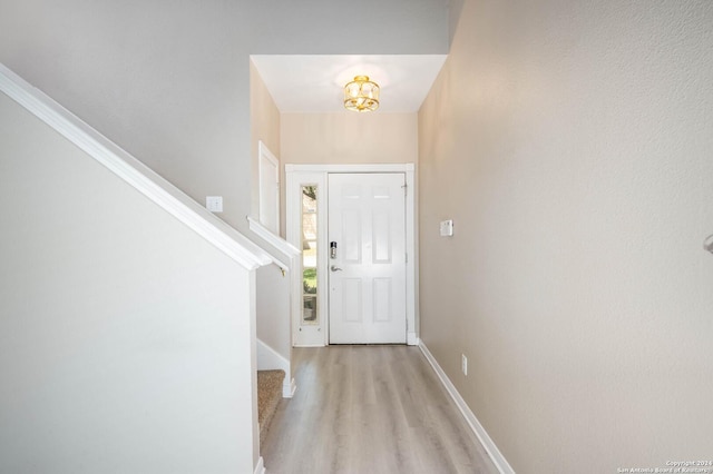 entryway with light hardwood / wood-style floors