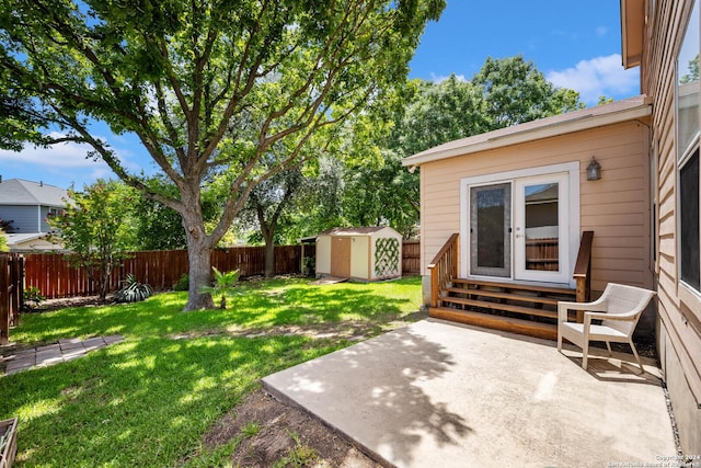 view of yard with a storage unit and a patio area