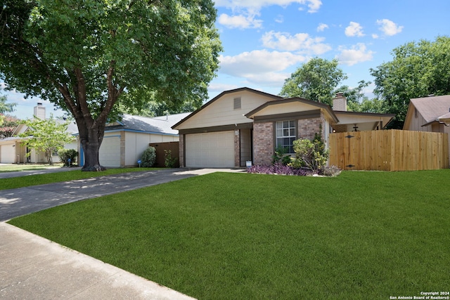 ranch-style house with a garage and a front lawn