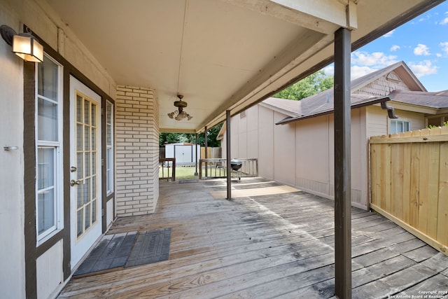 deck with a storage shed