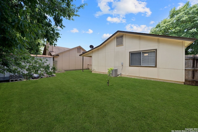 view of yard featuring central AC