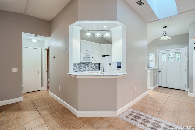 interior space with a skylight and sink