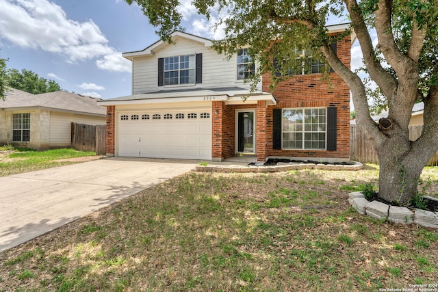 front of property with a garage