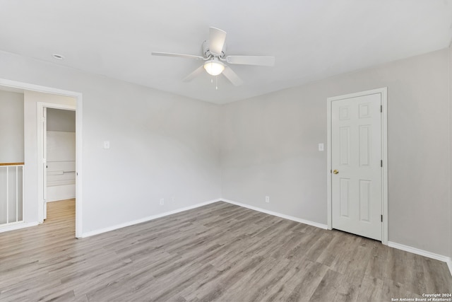 unfurnished room featuring ceiling fan and light hardwood / wood-style flooring