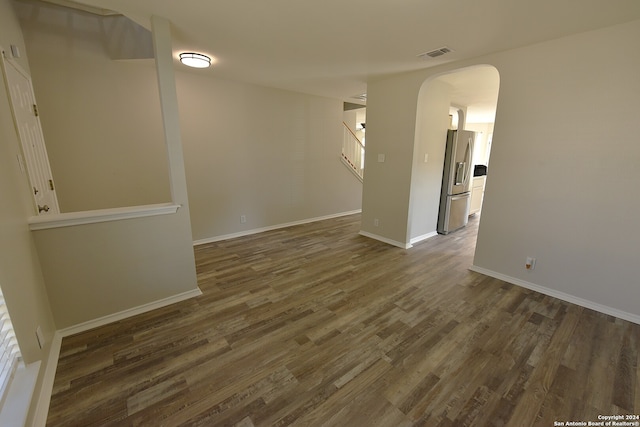 spare room featuring dark hardwood / wood-style floors