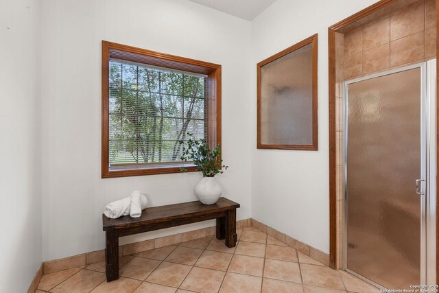 carpeted bedroom with a tray ceiling and ceiling fan