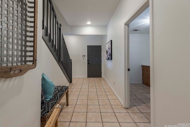 foyer with light tile patterned flooring