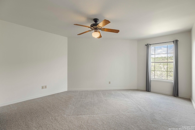 carpeted empty room with ceiling fan