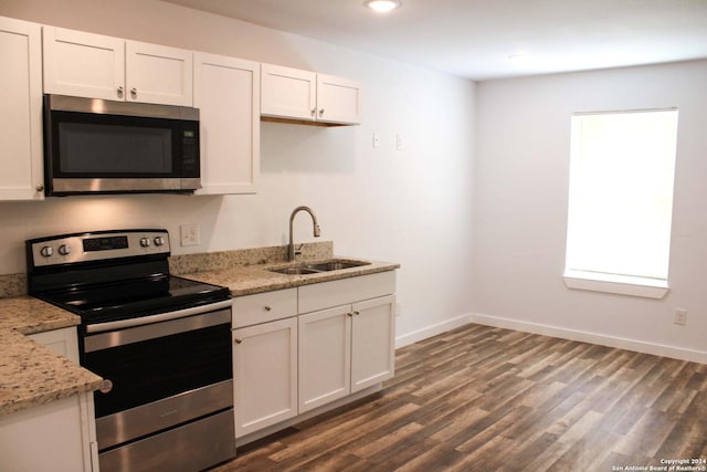 kitchen featuring white cabinets, sink, and appliances with stainless steel finishes