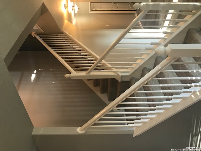 stairway featuring a high ceiling