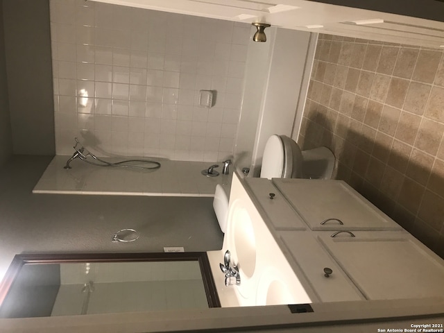 bathroom featuring vanity and toilet