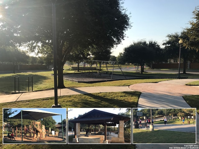 view of community featuring playground community and a yard