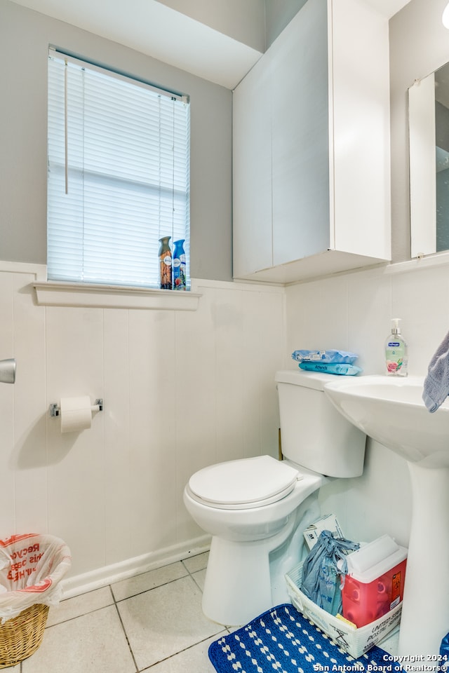 bathroom with tile patterned flooring and toilet