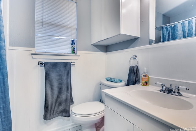 bathroom with vanity and toilet