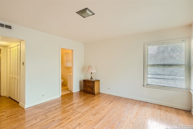 spare room featuring light hardwood / wood-style floors