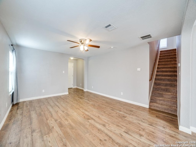 unfurnished room with ceiling fan and light hardwood / wood-style floors