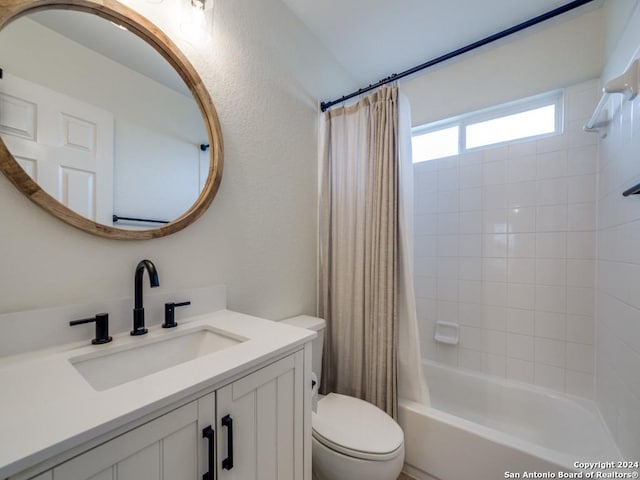 full bathroom featuring toilet, vanity, and shower / bathtub combination with curtain