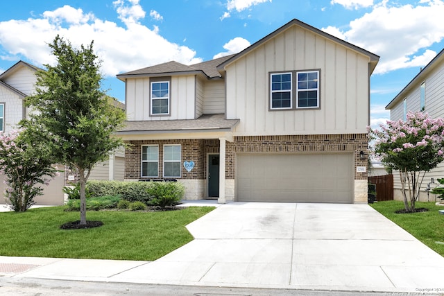 view of front of house featuring a garage and a front yard