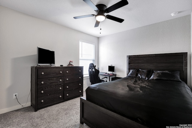 bedroom with light colored carpet and ceiling fan