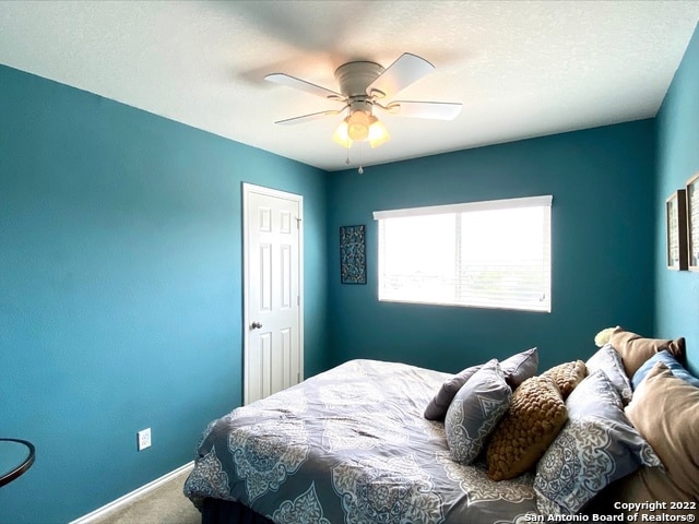 bedroom featuring carpet floors and ceiling fan