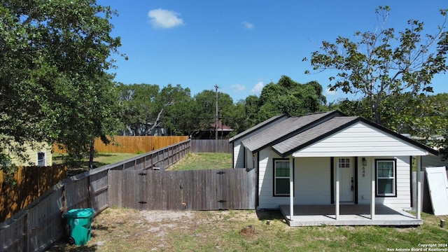 648 S 9th, Aransas Pass, TX 78336 - view of front of home with a fenced backyard and a porch