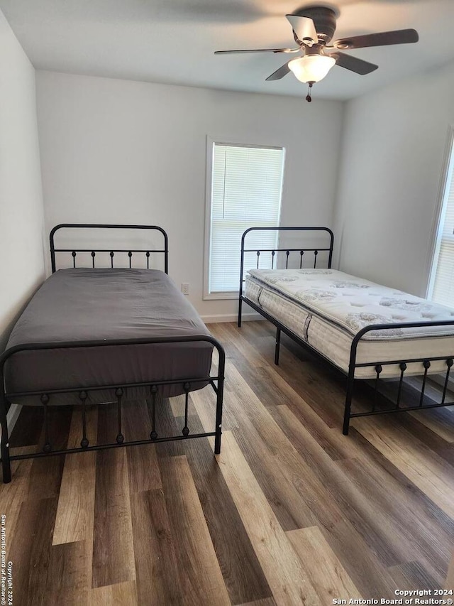 bedroom featuring ceiling fan and hardwood / wood-style flooring