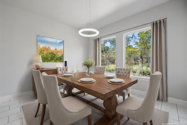 dining area with light tile patterned floors