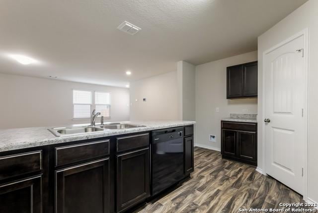 kitchen with dishwasher, dark wood-type flooring, and sink