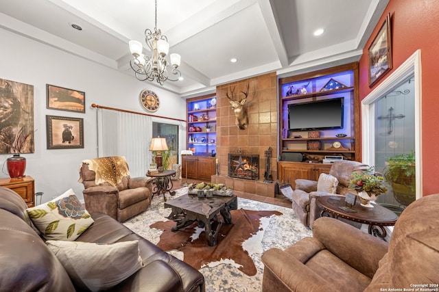 living room featuring an inviting chandelier, built in shelves, tile walls, beamed ceiling, and a tile fireplace