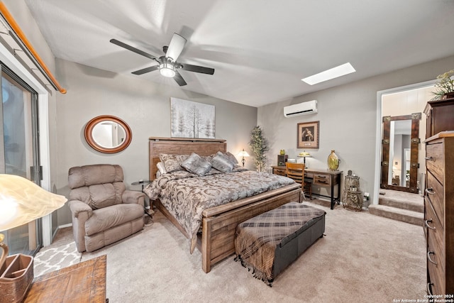 carpeted bedroom featuring a wall mounted AC, ceiling fan, and a skylight