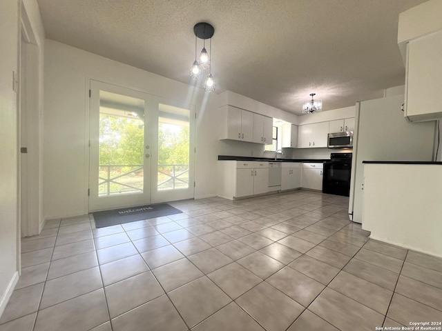 kitchen featuring electric stove, dishwasher, white cabinets, decorative light fixtures, and a chandelier