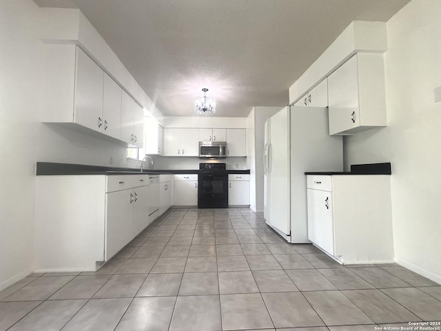 kitchen with sink, a chandelier, a textured ceiling, white appliances, and white cabinets