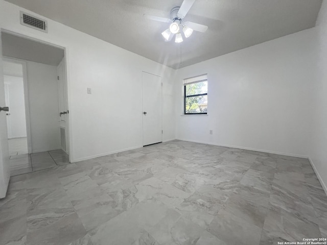 unfurnished room featuring ceiling fan