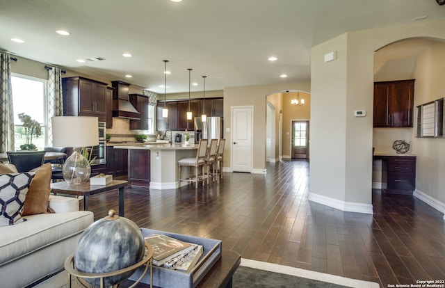 living room with dark hardwood / wood-style floors