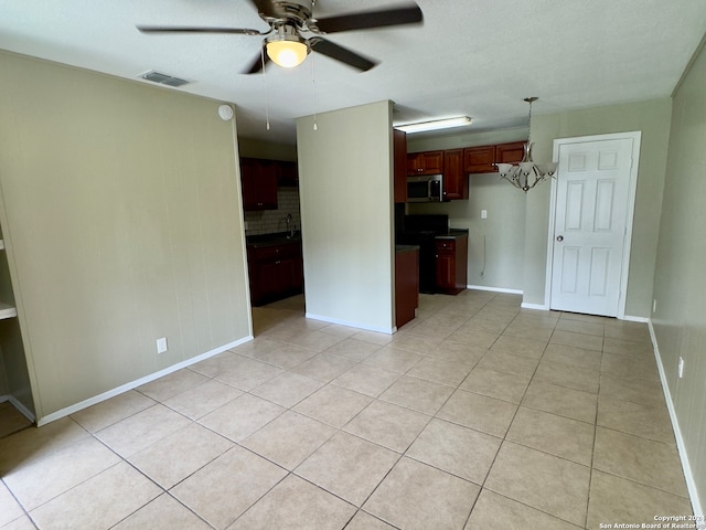 tiled empty room with ceiling fan