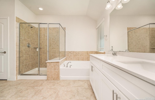 bathroom with vanity, separate shower and tub, tile patterned floors, and vaulted ceiling